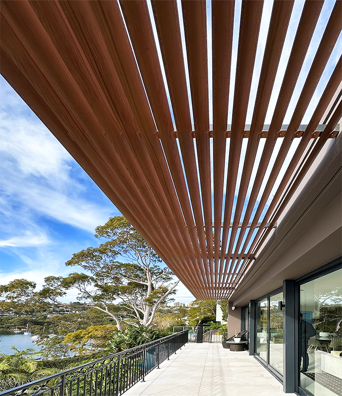 Vertical ribbon-cut louvres seen against sky